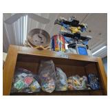 TOYS, POKÉMON TINS, MAGNETIC DISPLAY PAN, AND MORE ON TOP SHELF AND ON TOP OF CABINET MARKED 1393