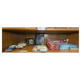 DIECAST CARS, UNO CARD SETS, AND MORE ON SHELF MARKED 1435