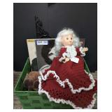 GREEN BASKET AND CONTENTS INCLUDING CROCKETT BED DOLL, PROPELLER NOSE RUDOLPH, EDDIE RABBITT / SEALS & CROFTS ALBUMS, OLD CAST IRON CORBEL SUPPORT, AND MORE