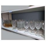 DEPRESSION GLASS STYLE STEMS AND SERVING PIECES ON SHELF MARKED 1508