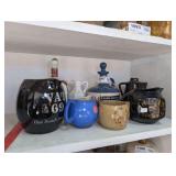 COLLECTIBLE DECANTERS AND POTTERY IN SHELF AREA MARKED 1097