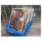 SMALL TUB FILLED WITH COMIC BOOKS