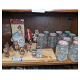 VINTAGE COMICAL BOTTLE STOPS, SANTA CLAUS MASON JARS, AND MORE ON SHELF MARKED 1452