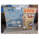 PAIR OF REPRODUCTION METAL SIGNS INCLUDING NEW YORK CENTRAL SYSTEM AND THE GREAT CANFIELD FAIR