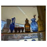 VINTAGE GLASS IN UPPER SHELF AREA MARKED 1002