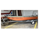B1...415 lb. capacity flat bottom boat with Johnson 20 hp motor, not locked up, working condition unknown, and trailer. Includes battery, gas tank, and other accessories. This lot is sold with an LW B