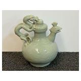 Vintage Chinese celadon porcelain puzzle teapot with a dragon handle and phoenix spout. See pictures or details.