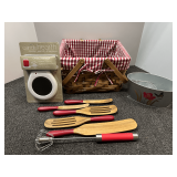 Lined woven basket with candle warmer, assorted utensils, and more. See pictures for details.