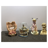 Assorted home decor to include the Last Supper hand sculpture, musical snow globe, Angel figurine, and more. See pictures for details.