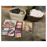 Mystery lot of household and crafting items, includes a vintage woven basket with assorted doilies, decorative storage boxes, cube bag with how to DVDs, rope, jute, and more. See pictures for details.