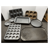 Assortment of bakeware, includes muffin tins, divided brownie pan, Nordic Ware stove top griddle, and more. See pictures for details.