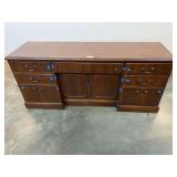 Large executive desk with five drawers, two file drawers, and center cabinet. Top does have wear, blue tape shown in photos are drawer marker locations for moving purposes, see pictures for details.