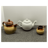 Two-tone teapot with matching creamer, also includes a porcelain Old Amsterdam teapot, three pieces total, see pictures for details.