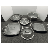Curtis Stone cookware with Dura-Pan nonstick coating. Also comes with three odd lids, see pictures for details.