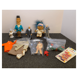 Vintage small toys and collectibles to include a vintage Stan Laurel doll, troll doll, action figure, and more. Tub is not included, see pictures for details.