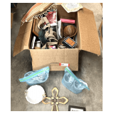 Mystery lot of assorted household items to include home decor, mason jar, collectible tins, and much more. See pictures for details.