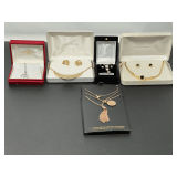 Jewelry Assortment Including Necklaces, Earrings, and Jewelry Sets