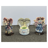 Angel figurines, and heart shaped musical snow globe, three pieces total, see pictures for details.