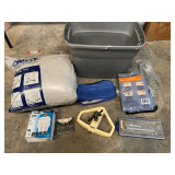 Mystery lot of assorted items to include metal sprinkler, hammer, ratchet and socket set, vacuum storage bags, and more. See pictures for details.