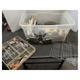 Tub of assorted kitchenware to include a grill basket, assorted utensils, glass bakeware, and more. See pictures for details.