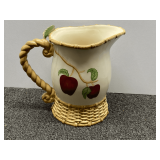 Ceramic, apple themed water pitcher with basket weave base, see pictures for details.