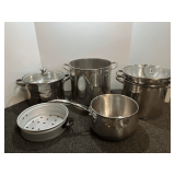 Assortment of cookware to include Biltmore, Wolfgang Puck, Cooks Tools, and more. Approximately eight pieces, see pictures for details.