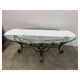Oval glass top coffee table with beveled edge and metal/wrought iron frame. See pictures for details.