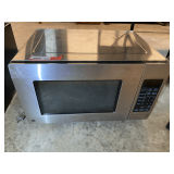 GE microwave, powers up, working condition unknown, see pictures for details.