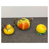 Vintage porcelain Majolica style fruit shaped ceramics. Includes tea pot, creamer and covered sugar dish, see pictures for details.