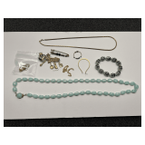 Assortment of ladies fashion estate jewelry to include necklaces, brooch, bracelet, and more. Tub is not included. See pictures for details.