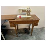 Vintage Singer Touch & Sew machine with cabinet, powers up, see pictures for details.