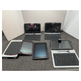 Tablets with covers, believed to be Android, three have keyboards, working condition unknown, see pictures for details.