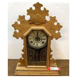 Antique E. Ingraham oak gingerbread mantel clock with key, see pictures for details.