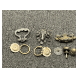 Assortment of vintage drawer pulls, also includes a brass rams head belt buckle, tub is not included, see pictures for details.