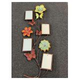 Decorative metal wall hanging with floral and butterfly's motif, and picture frames. See pictures for details.
