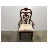 Traditional wood dining armchair, with a carved crest rail and an upholstered seat, see pictures for details.