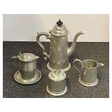 Vintage English pewter teapot and sugar and creamer, also includes a vintage USA pewter footed creamer, four pieces total, see pictures or details.