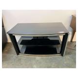3 Shelf Entertainment Center, black with silver trim, see pictures or details.