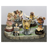 Assortment of collectible Angel/cherub figurines and more, positioned on a rocky landscape base. Seven pieces total, see pictures for details.