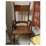 ANTIQUE OAK SPINDLE SIDE CHAIR W/ CARVINGS AND ORIGINAL LEATHER SEAT (MISSING COUPLE OF SPINDLES ON BACK) 26" WIDE X 19" DEEP X 44" TALL
