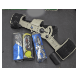 GOLF BALLS AND RIGHT ANGLE GOLF STROKE TRAINER