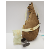 Canteen, Stone Figure, and Miniature Metal Boot