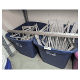 TWO BLUE TUBS FILLED WITH SHELF SUPPORTS AND MORE
