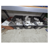 THREE STORAGE TUBS AND TWO MILK CRATES FILLED WITH 4-IN PVC PIPE FITTINGS