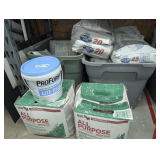 TWO TUBS AND ITEMS ON FLOOR IN FRONT INCLUDING SHEETROCK JOINT COMPOUND