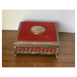 VINTAGE WEST GERMANY TIN JEWELRY BOX WITH COURTING COUPLE HAND PAINTED MEDALLION ON TOP OF RED VELVET TOP - MUSIC BOX (WORKS) 6" SQUARE X 2 3/4" TALL