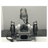Delta shop master bench grinder with light, powers up, appears to have never been used, see pictures for details.