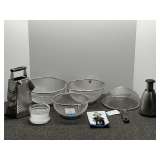 Kitchen items to include assorted strainers, grater, chopper, and corkscrew. See pictures for details.