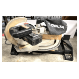 Delta 10"compound miter saw, powers up, see pictures for details.