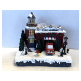 RESIN CHRISTMAS VILLAGE FIRE STATION WITH LED LIGHTS 10" WIDE X 7" DEEP X 10" TALL